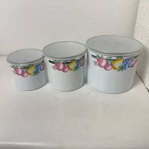 vintage GMI enamelware canister set with a fruit motif.